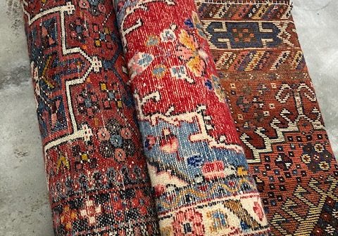 Rolled up rugs that are cleaned